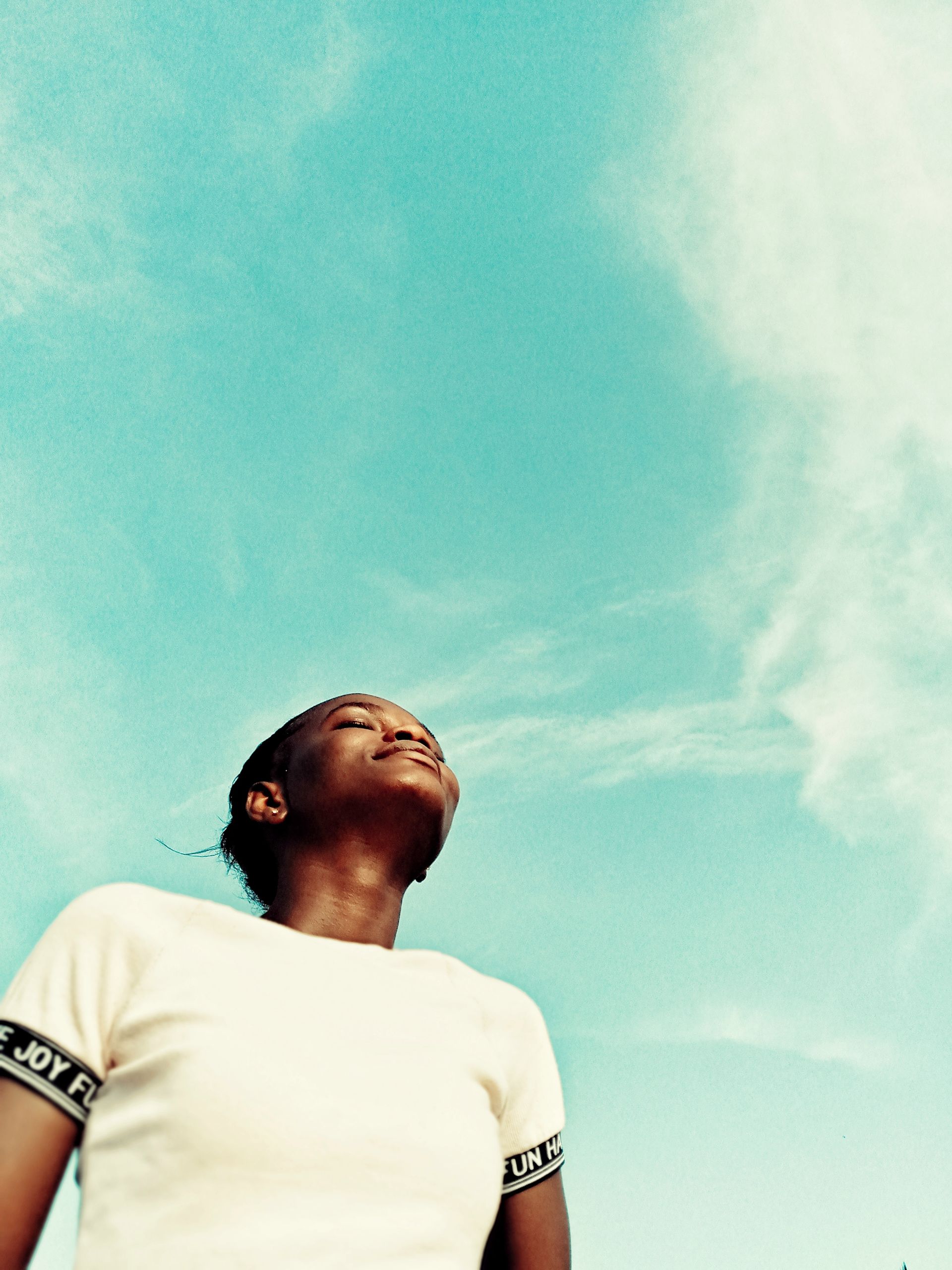 A person looking toward an open sky