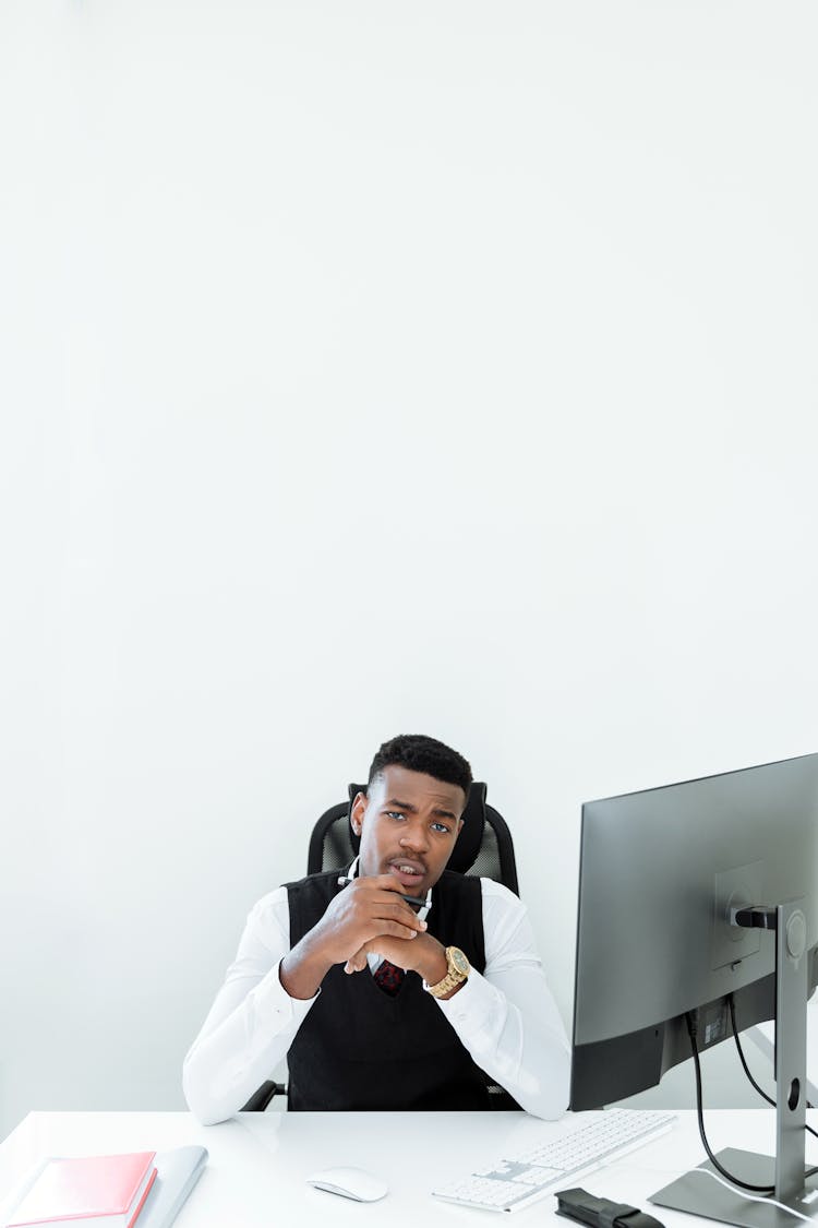 A Man Sitting In His Office