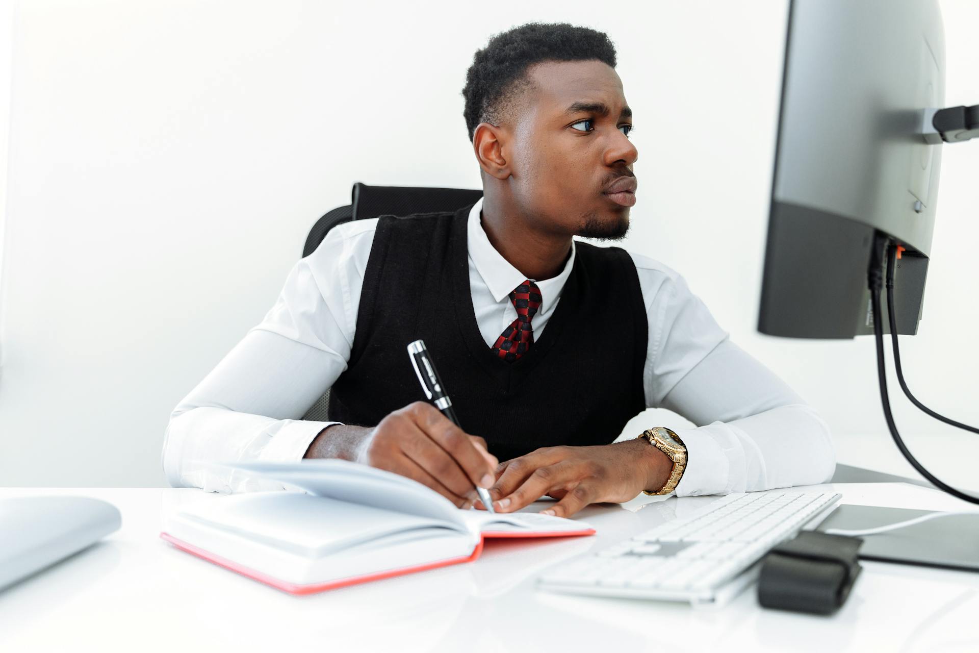 Man in White Dress Shirt Holding Pen