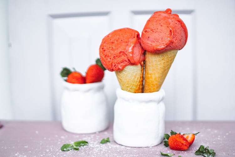 Cones Of Strawberry Ice Cream In White Jar