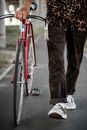 A Person Walking His Bicycle