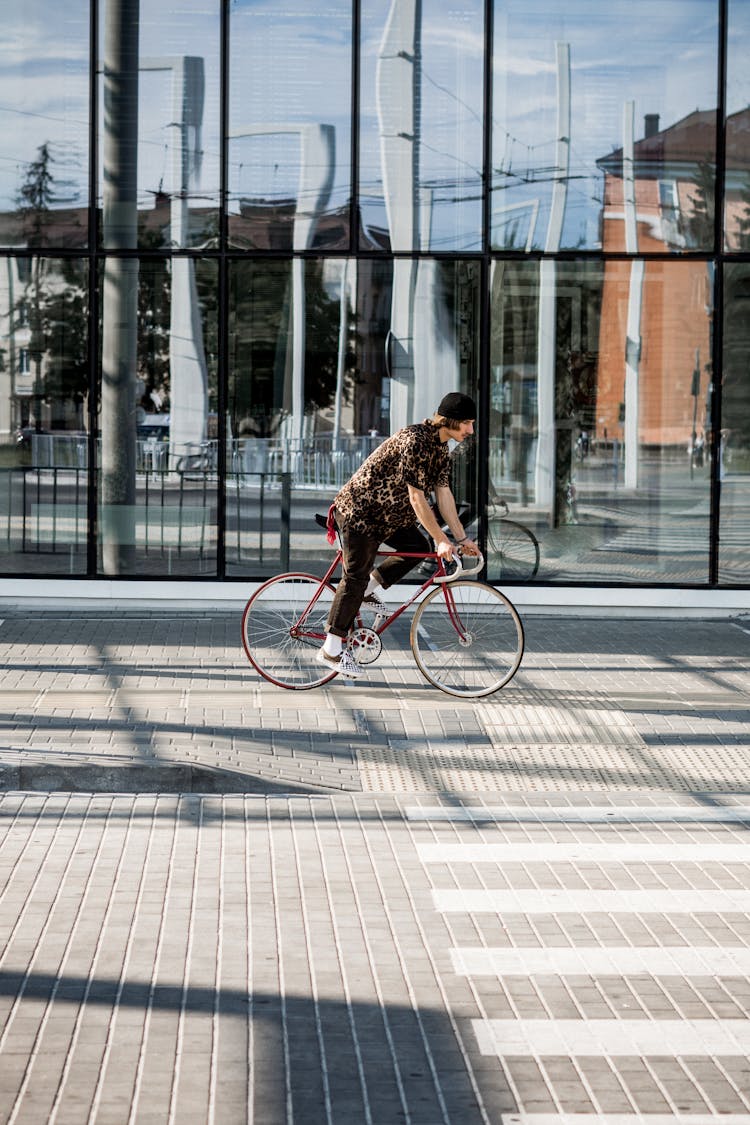 Photo Of Man Riding A Bike