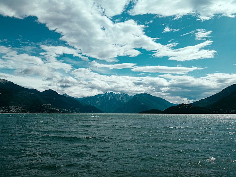 Impressive View Of Rough Mountains Surrounding Rippling Lake