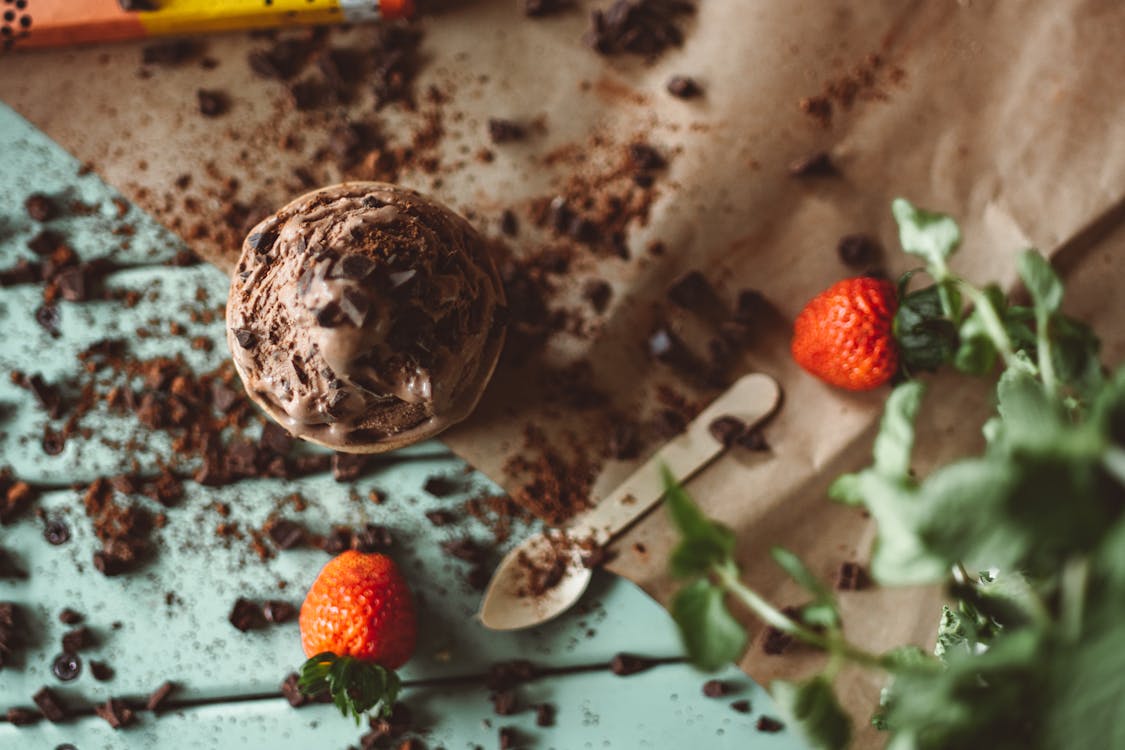 Strawberry Chocolate Flavored Ice Cream on a Wooden Surface