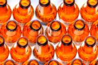 Opened Beer Bottles In a Row