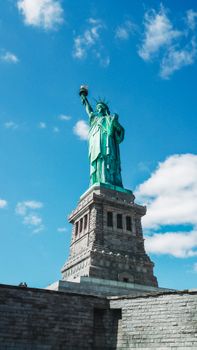 Iconic Statue of Liberty in New York City under clear blue skies, a symbol of freedom and democracy.