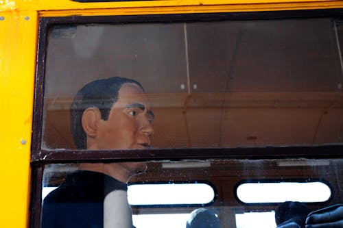 Free stock photo of bus window, mannequin, public transportation