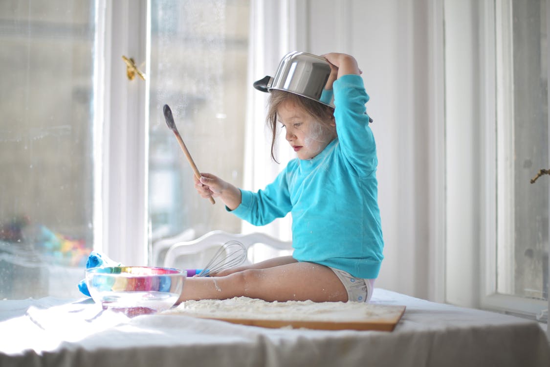 A Girl Playing With Flour