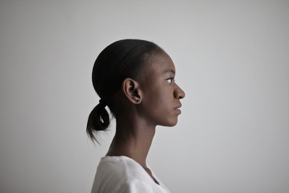 Side profile shot of a woman on a white background.