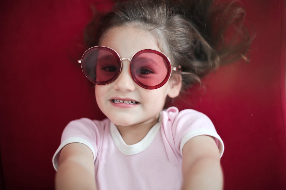 Portrait of Cute Girl Wearing Sunglasses