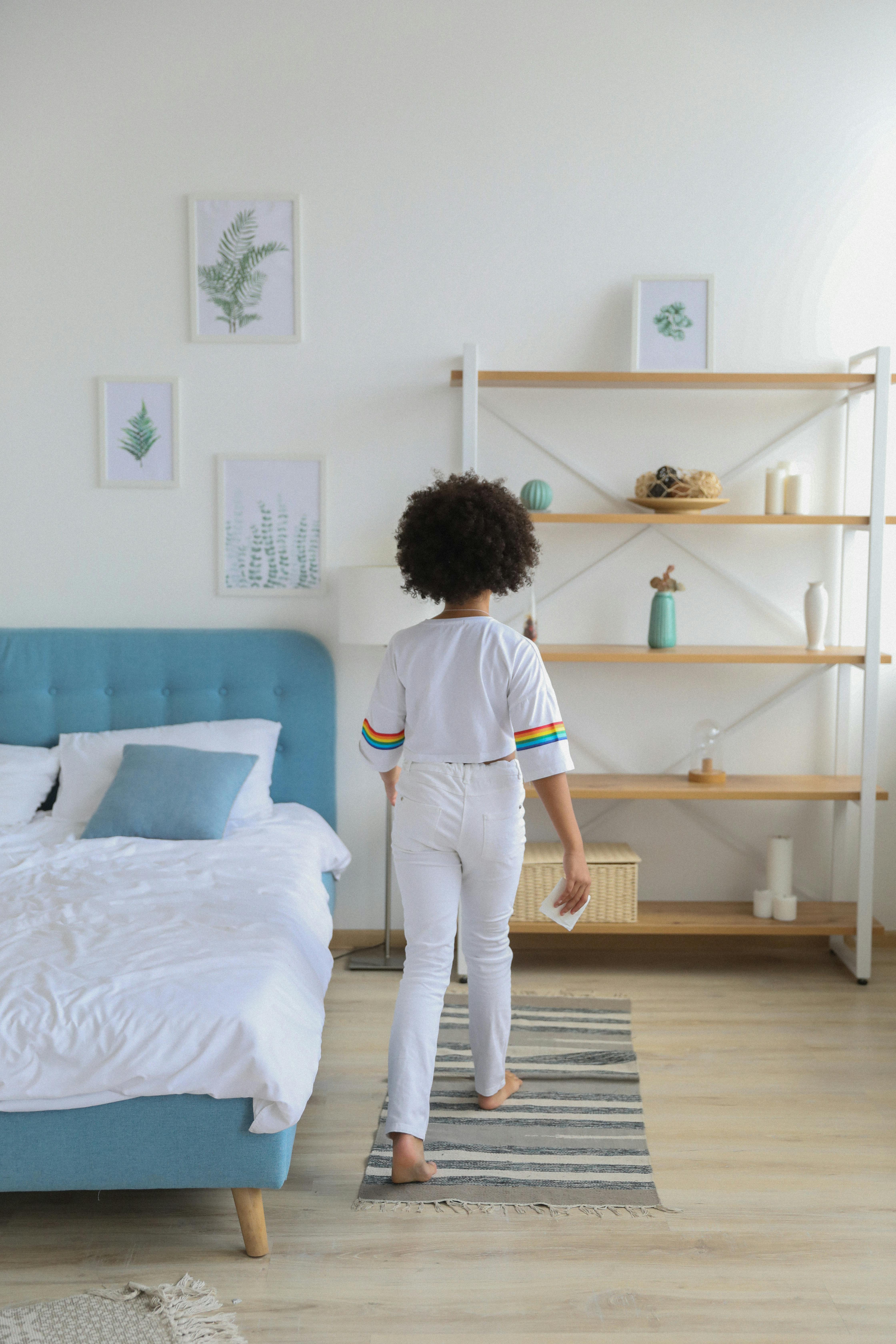 black girl in casual outfit in modern comfortable room