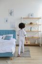 Black girl in casual outfit in modern comfortable room