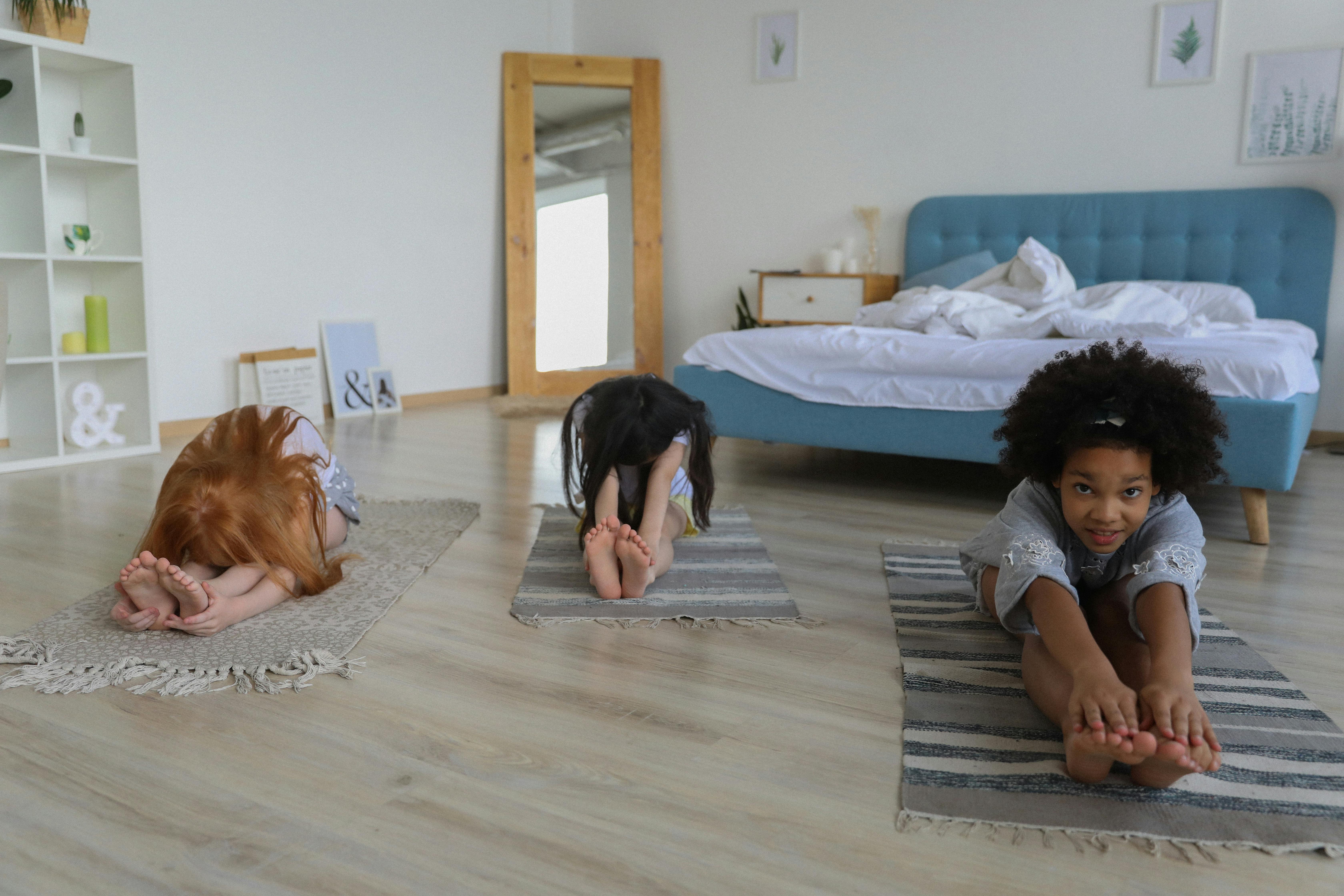 charming girls stretching in bedroom