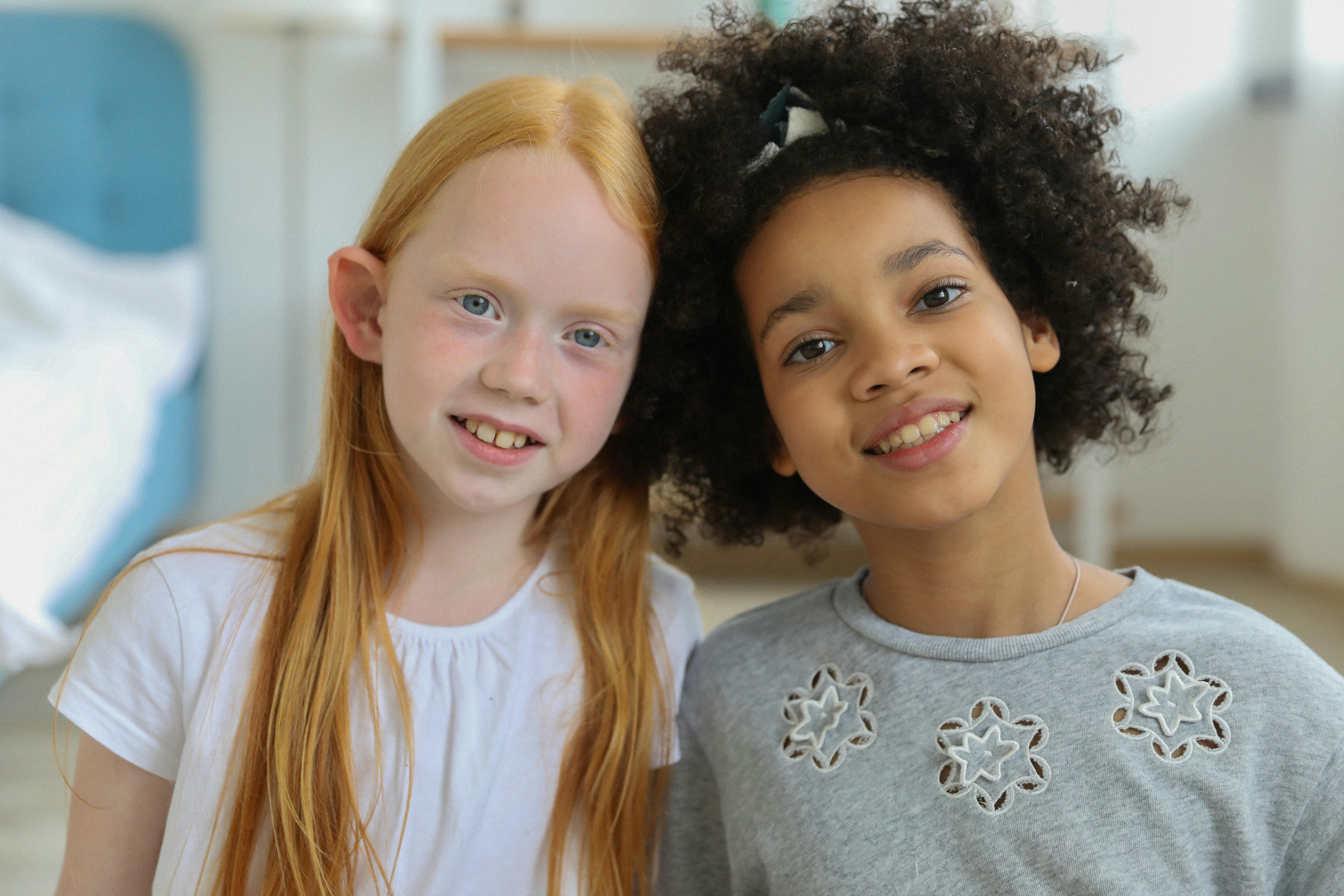 positive diverse children in bright room