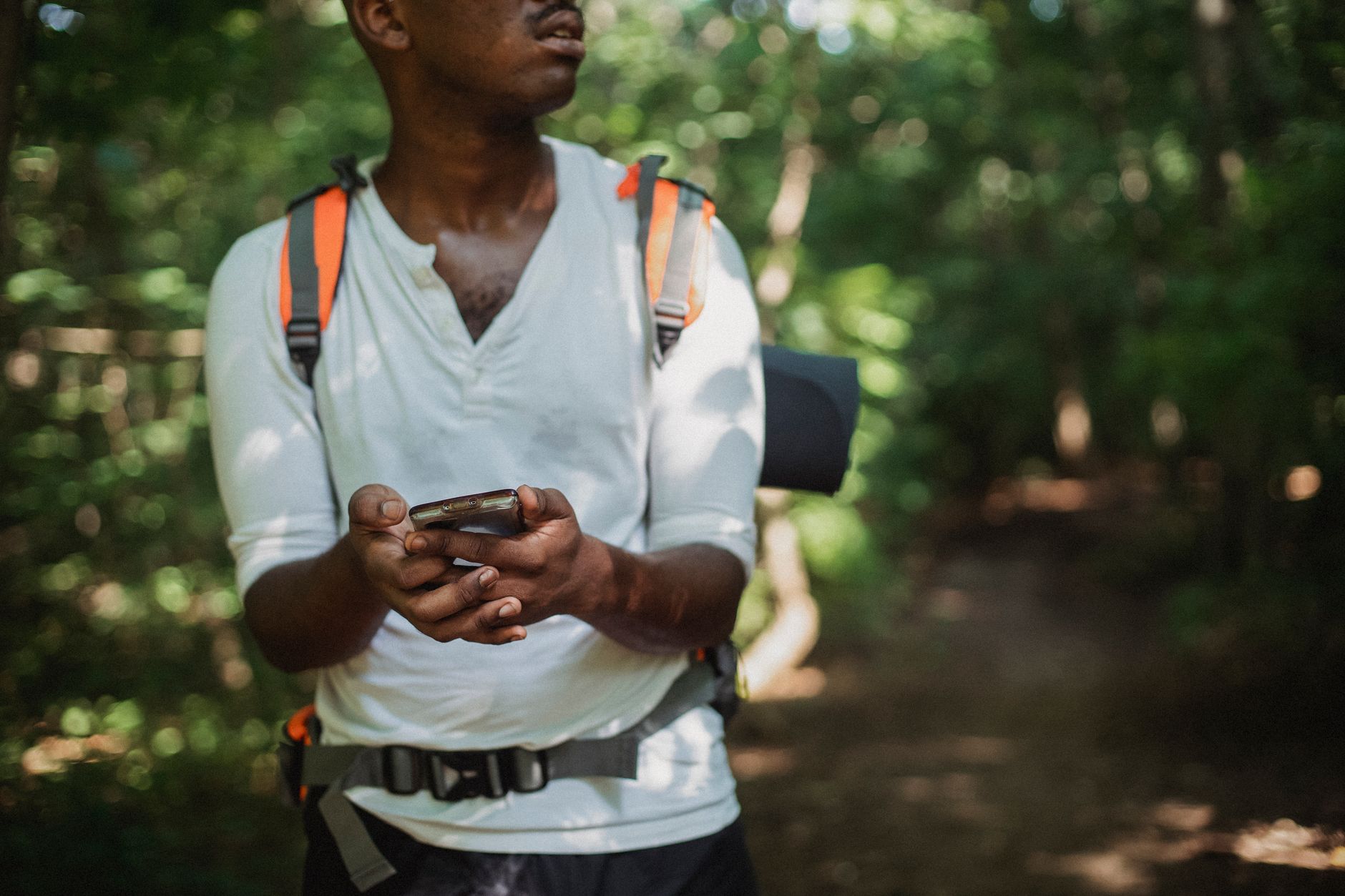hiker navigating wilderness trail