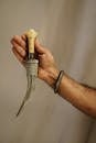A Person Holding Sharp Pointed Knife