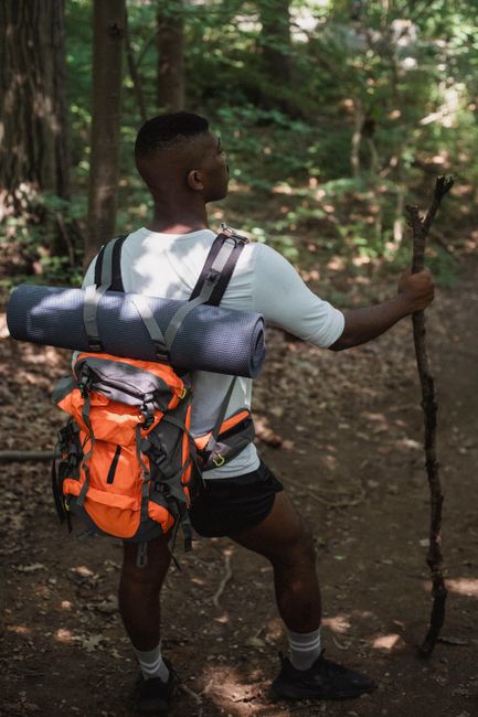 Collection of hiking gear on a rock