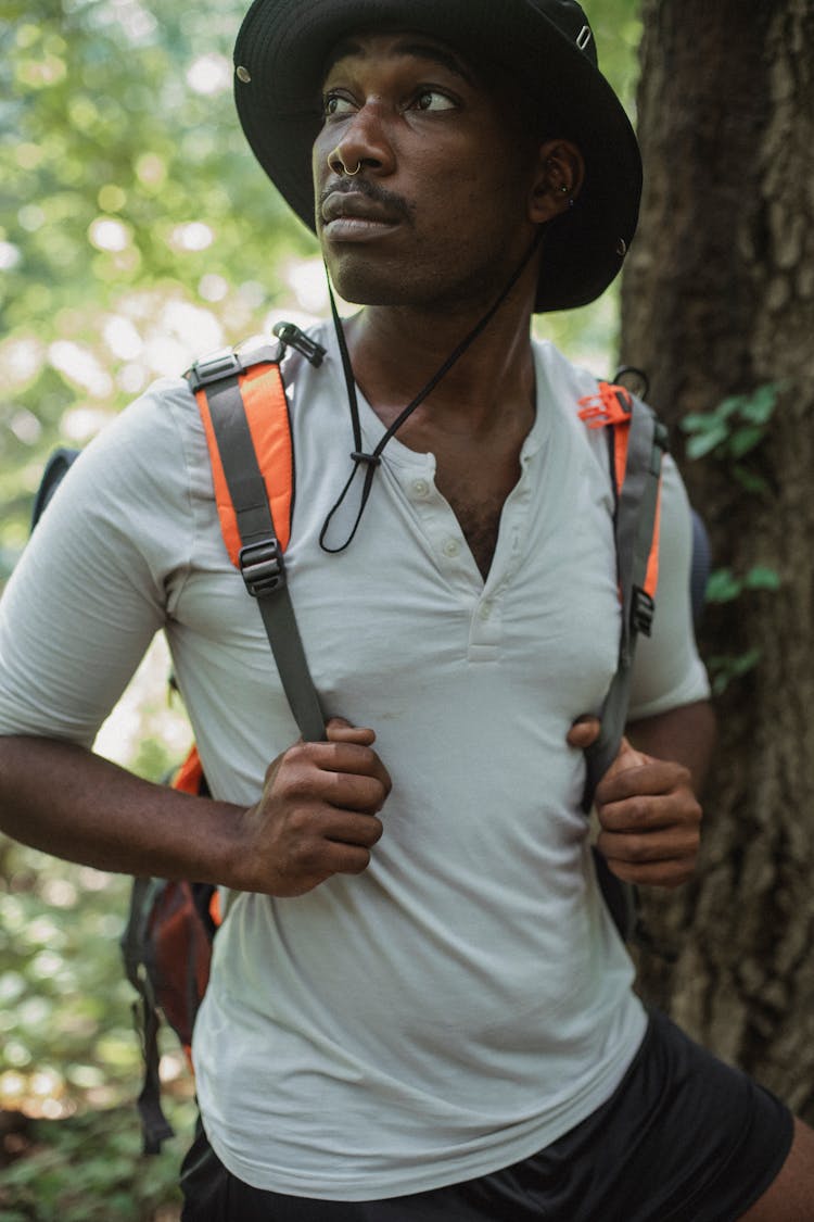 Crop Dreamy Black Traveler With Backpack In Forest