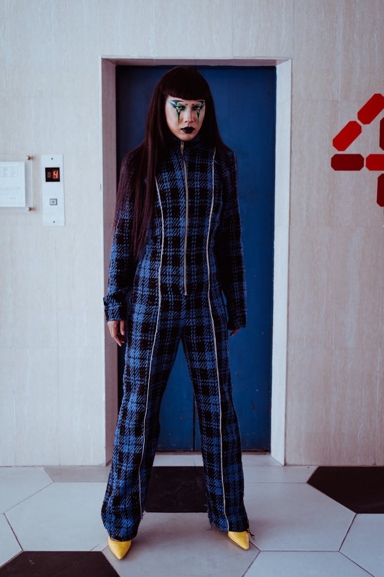 Serious Asian Woman Standing Near Elevator