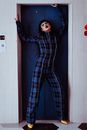Stylish Asian woman with make up standing near elevator
