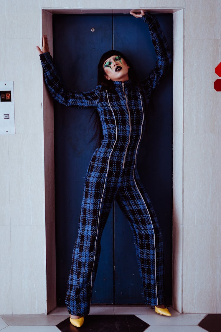 Stylish Asian Woman With Make Up Standing Near Elevator