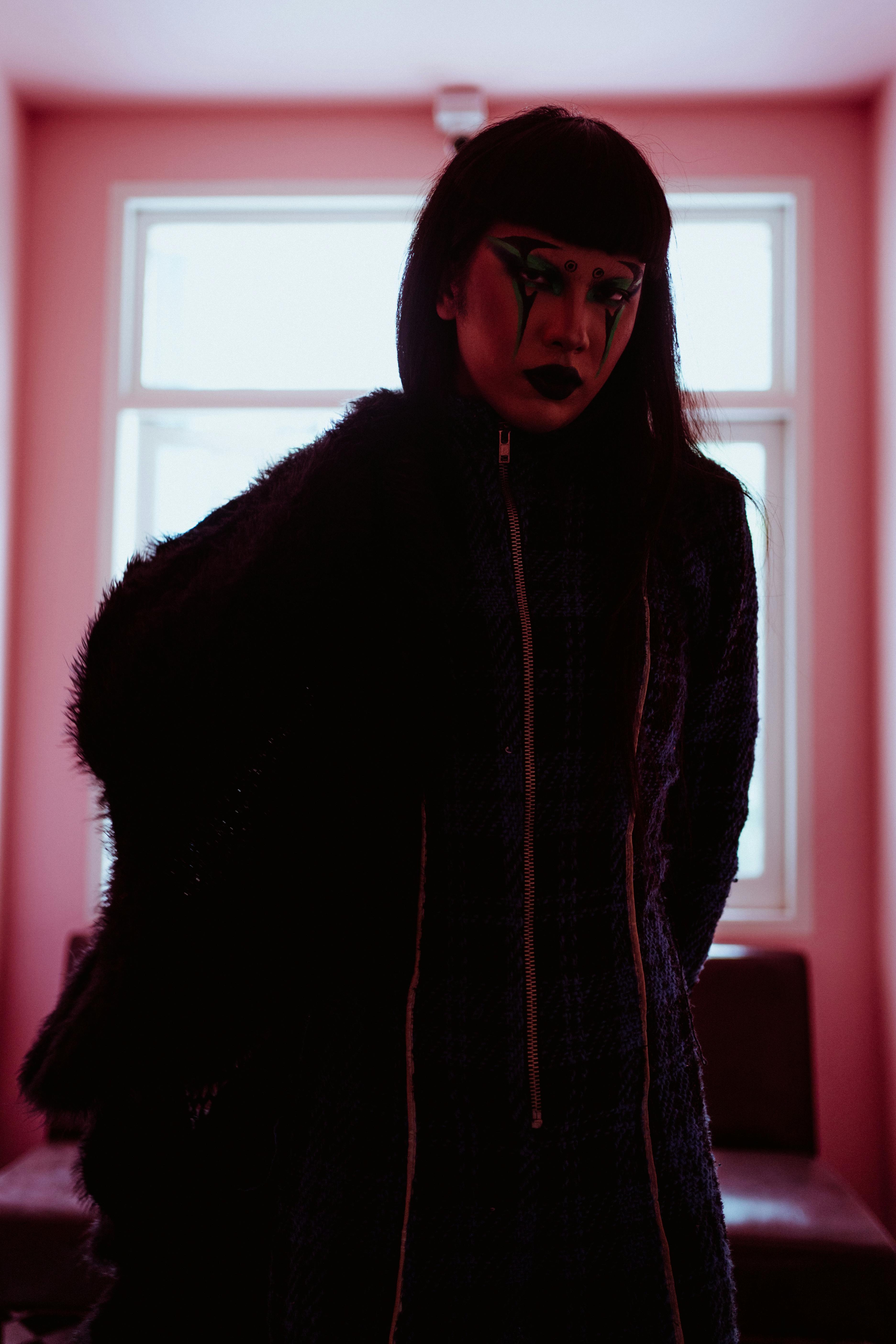 trendy asian woman putting on fur