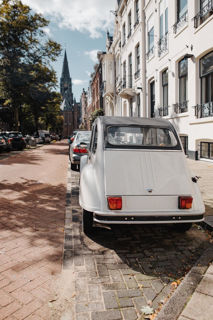 Cars Parked On The Sidewalk