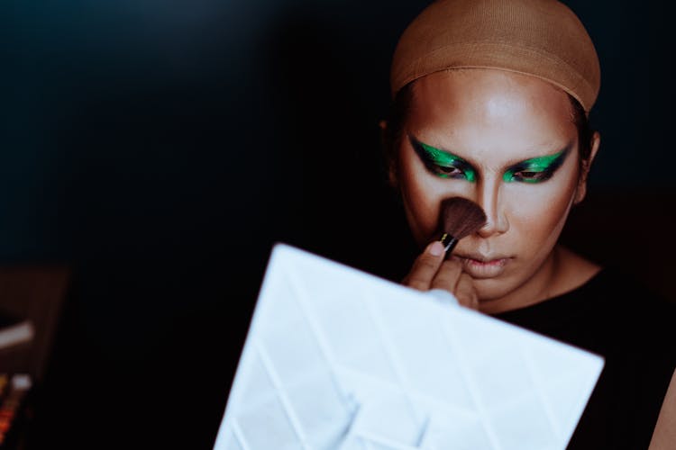 Crop Asian Actress Applying Makeup On Face At Work