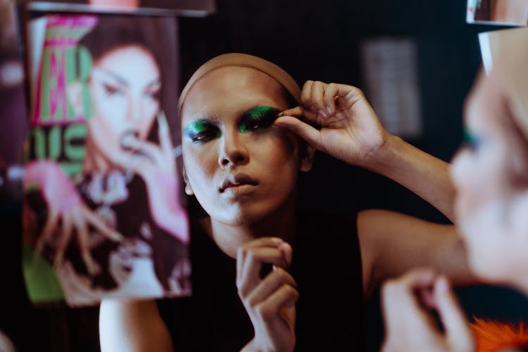 Ethnic Woman Gluing False Lashes In Dressing Room