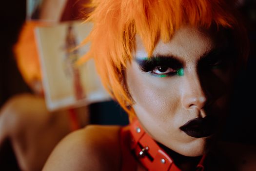 Crop extravagant woman with bright makeup and dyed hair