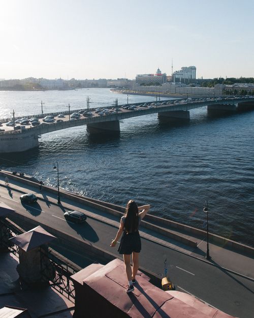 Free Urban aerial view of a woman standing near Liteyny Bridge in Saint Petersburg. Stock Photo