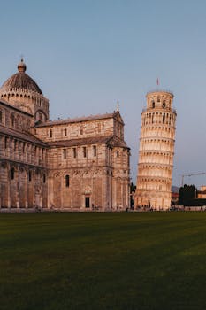 Captivating sunset view of the iconic Leaning Tower of Pisa in Italy.