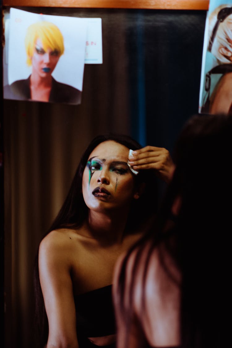 Man Cleaning Face From Makeup With Tissue