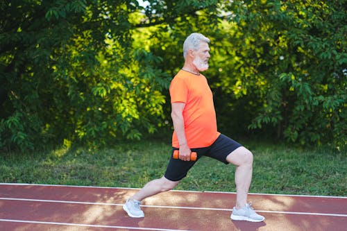 Free Senior man doing sport exercises Stock Photo