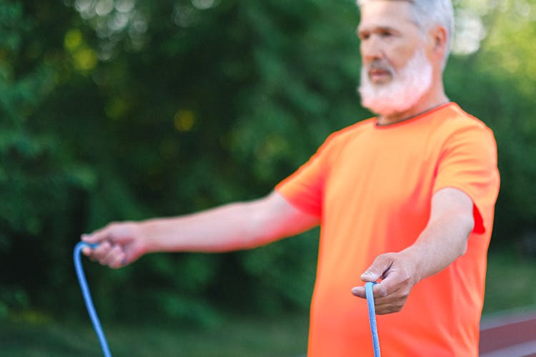 Senior Man Doing Sport Exercise With Jump Rope