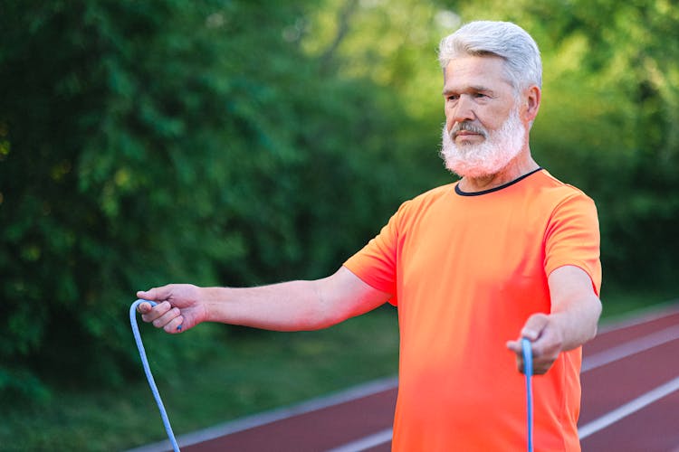 Serious Aged Sportsman Jumping On Skipping Rope