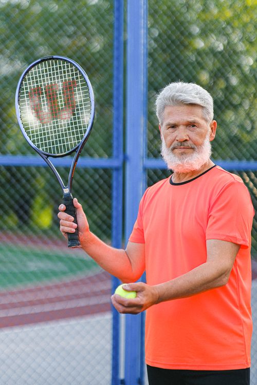 Man Using Tennis Racket Man About to Strike Using Tennis Racket · Free Stock Photo