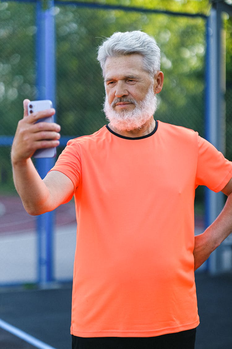 Mature Sportive Man Taking Selfie On Smartphone