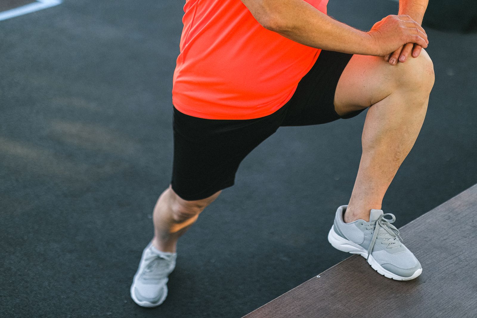 Person adjusting a knee support before walking outside