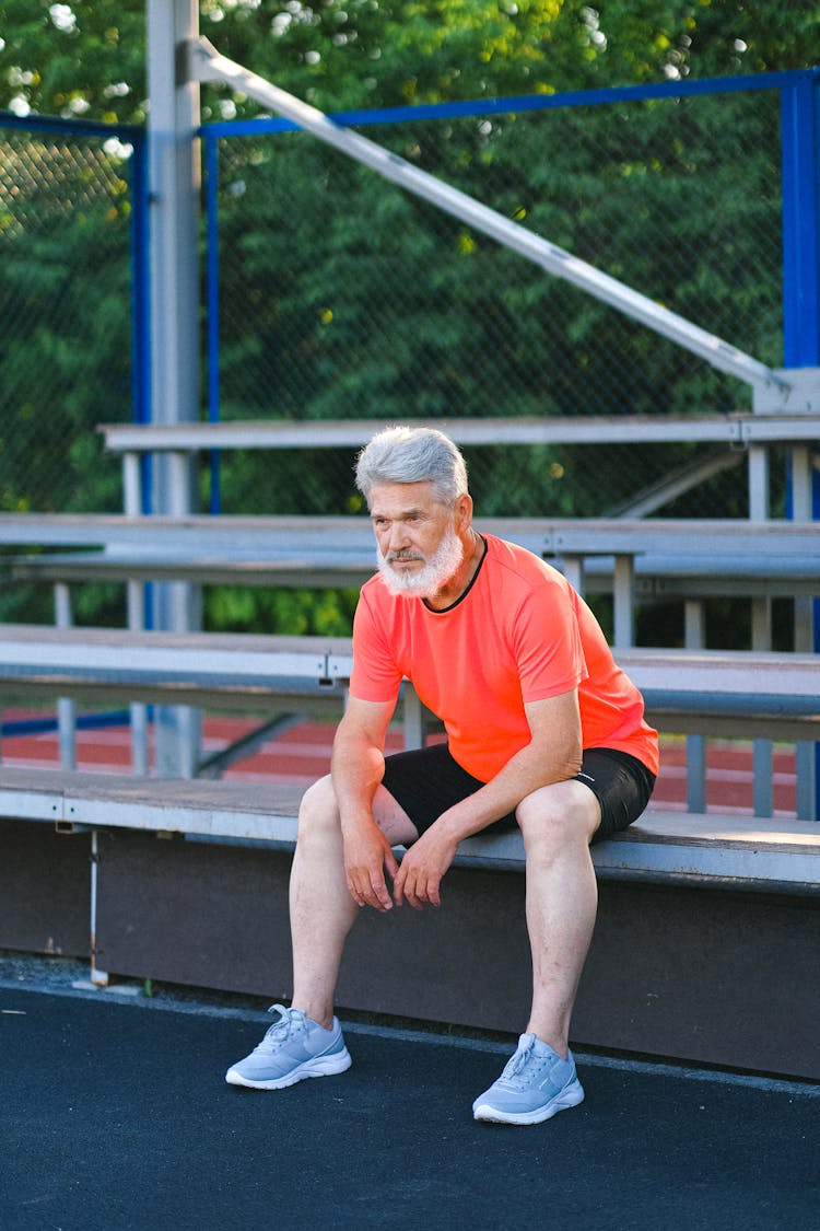 Confident Mature Man Resting After Training