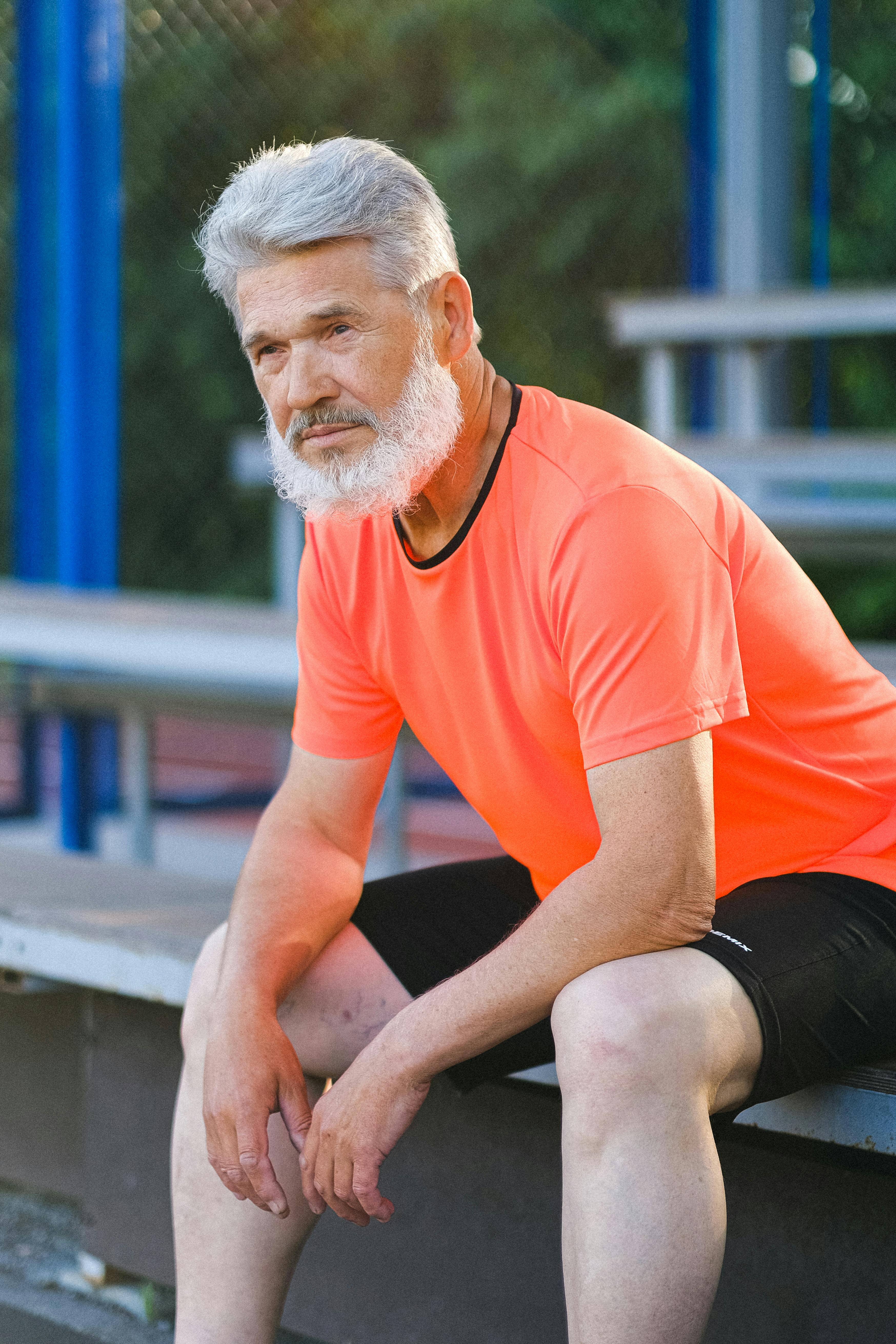 sportsman resting after hard workout on stadium