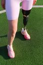Crop disabled woman standing on stadium