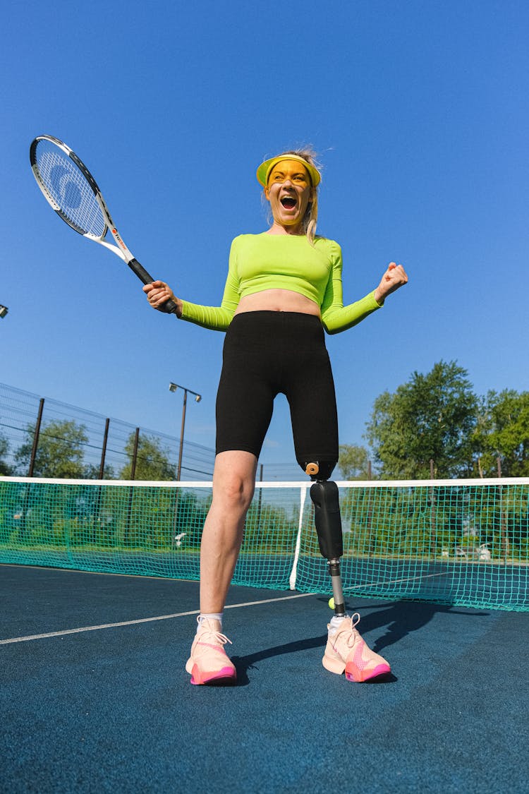 Woman With Prosthetic Leg Playing Tennis