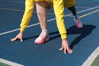 Person in Yellow Pants and Red and White Sneakers