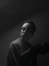 Man in Black Framed Eyeglasses and Gray Sweater