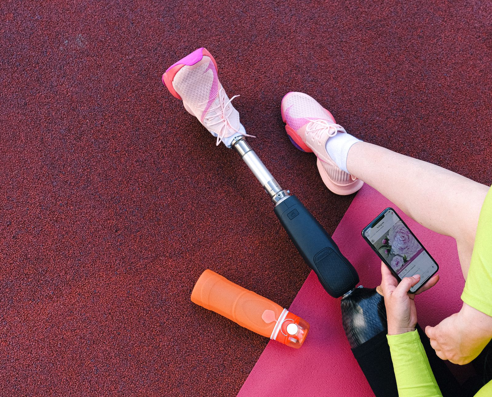 Athlete stretching on an outdoor track before sport activity