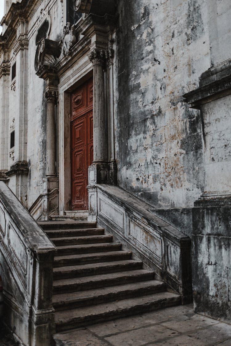 Gray Concrete Steps Near Brown Wooden Door