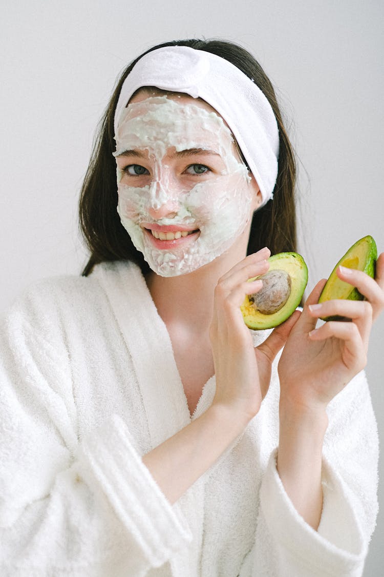 Smiling Woman With Avocado And Mask