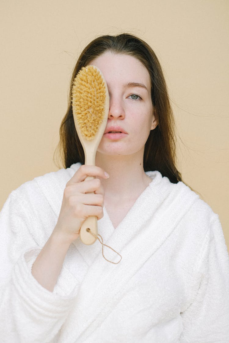 Calm Woman With Brush For Dry Massage