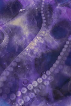 Creative close-up of octopus tentacles in a vibrant purple hue with abstract bubbles.